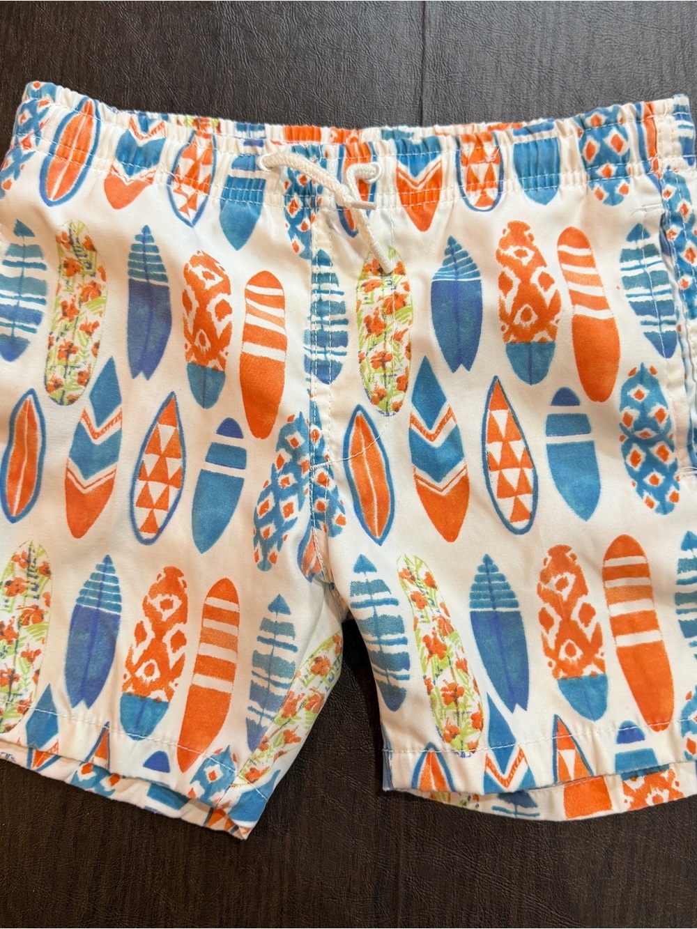 Ingear Kids White Swim Shorts with Orange & Blue Surfboard Print Sz L (10-12)